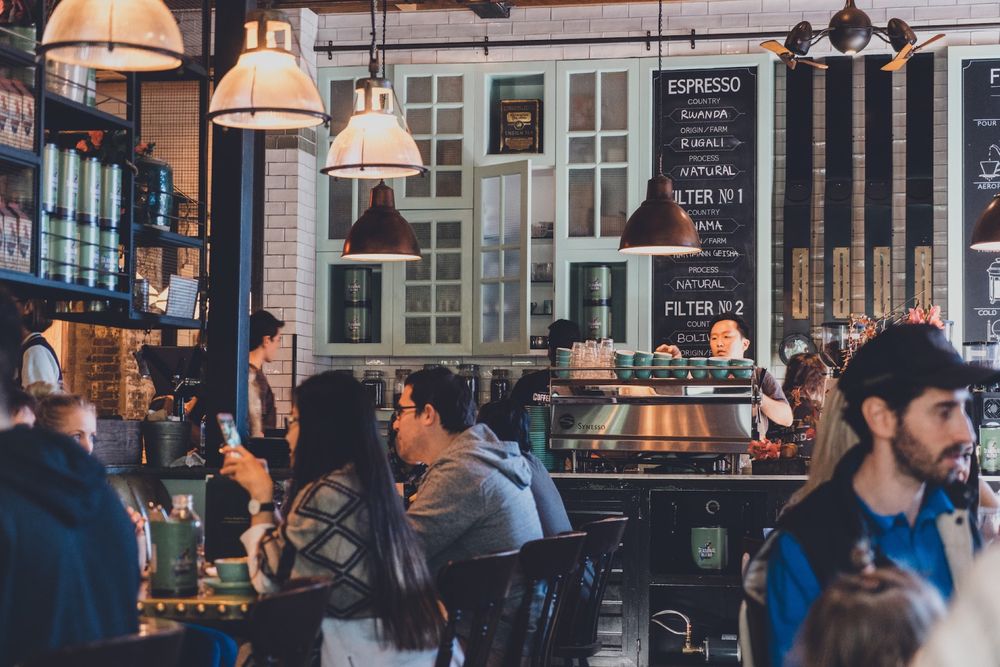 A busy gastropub floor operating with total precision
