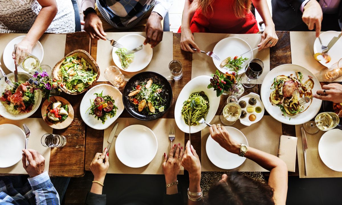 Guests enjoying a pre-ordered sharing feast
