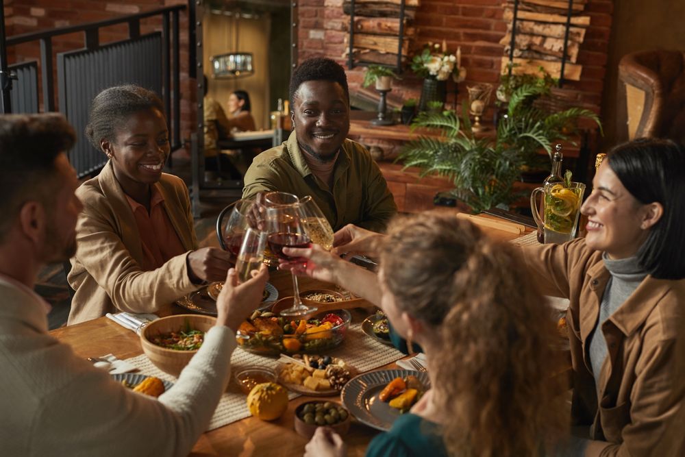 Group toasting at a restaurant table